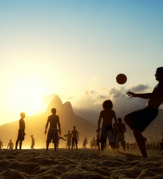 Playing football on Ipanema Beach, Rio de Janeiro