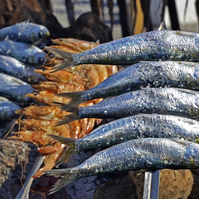 Sardines cooking on a skewer, El Palo, Málaga