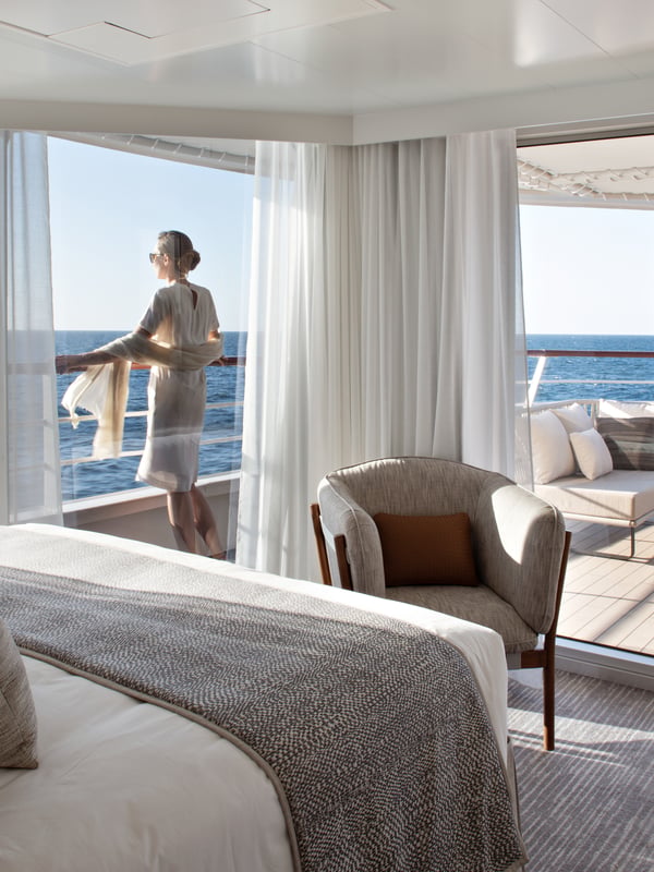 traveller on balcony ponant ship LE BOUGAINVILLE 