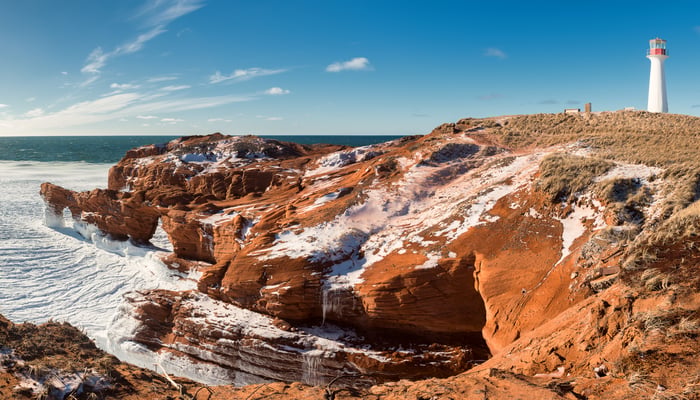 Borgot lighthouse on the red cliffs of the Magdalen Islands, Canada