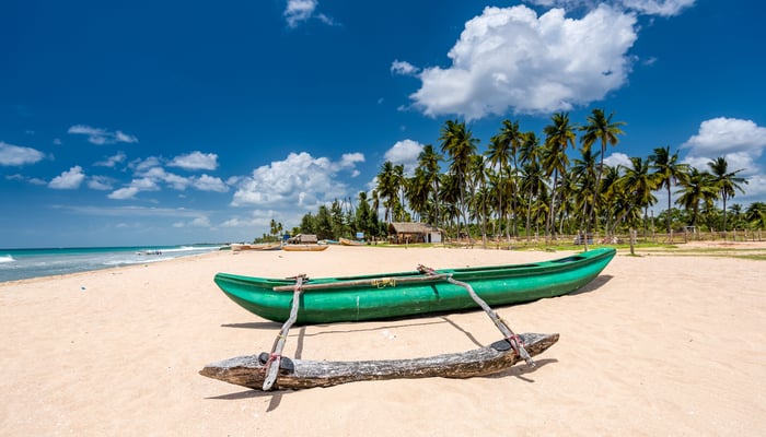 Fishing boat on Nilaveli beach near Trincomalee, Sri Lanka