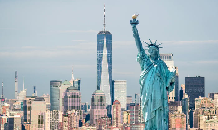 The Statue of Liberty and New York City skyline - a view you may visit on a world cruise