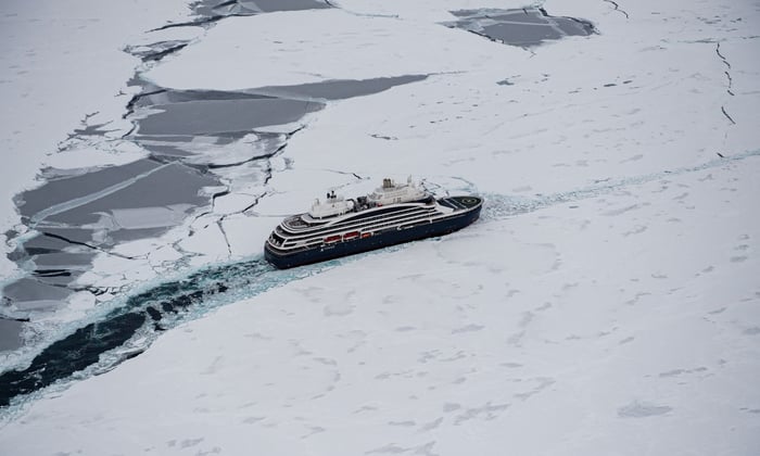 Le Commandant Charcot navigating through the ice in the Arctic