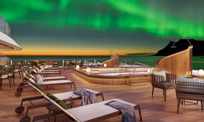 Seabourn Venture cruising under the Northern Lights