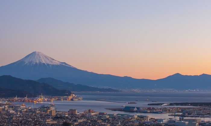 Snow capped Mount Fuji overlooking the unique port Shimizu, Japan