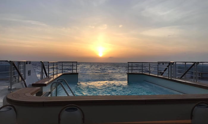 Ponant - Le Bougainville, sunset over the pool deck