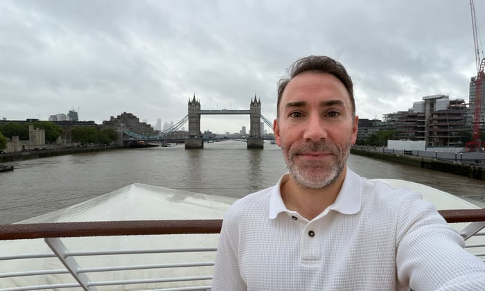Alex Loizou on the deck of Star Pride by London Tower Bridge