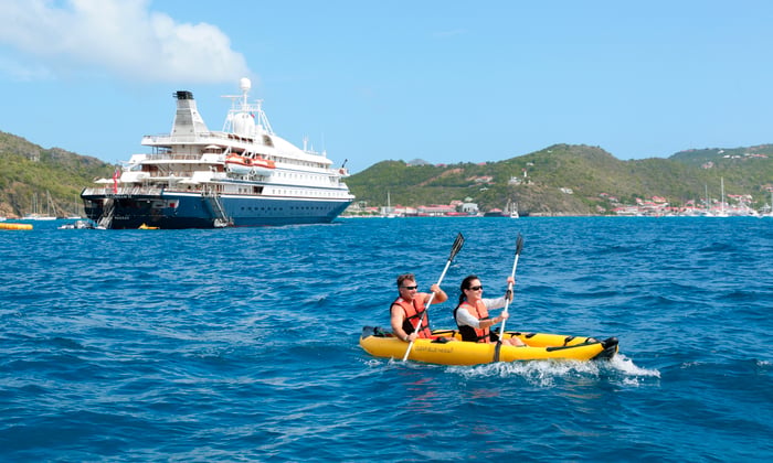 Kayaking from the watersports platform on SeaDream Yacht Club