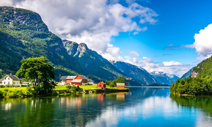 a typical village in the Norwegian Fjords which can be visited on a small ship cruise from UK ports
