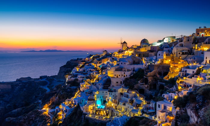 Oia village at night in Santorini, Greece, a popular call on a small ship Greek island cruise