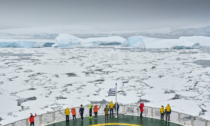 Guests on Ponant's Le Commandant Charcot observe the Antarctic sea ice