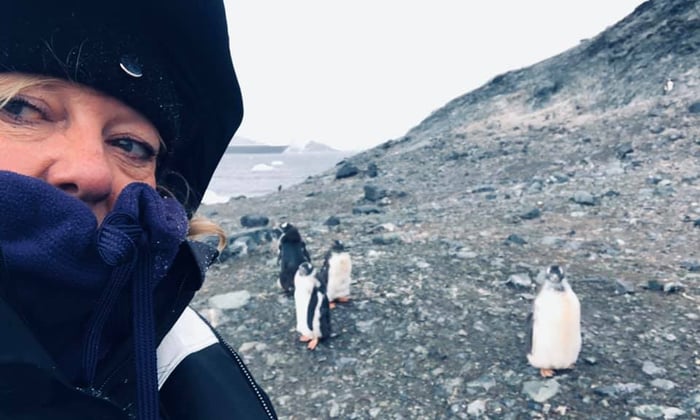 Sharon and penguins in Antarctica