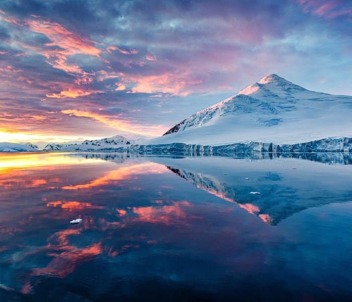 Icebergs and mountains during sunset in the Antarctic Peninsula