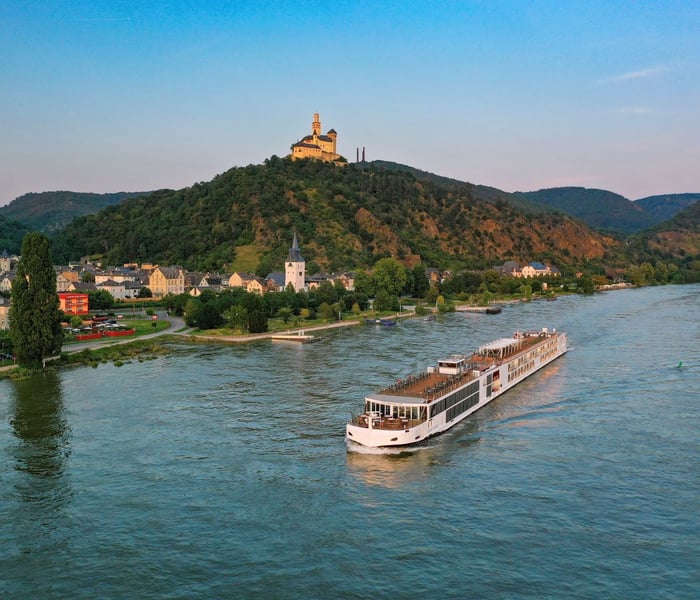 Viking Longship at sunset with a view of Braubach and Marksburg Castle.
