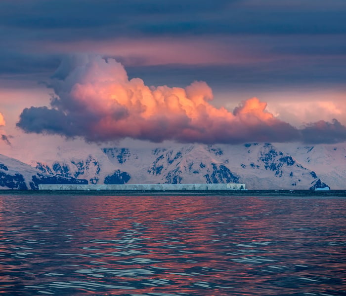 Midnight sun over the icebergs of the Drake Passage near the Antarctic Peninsula in Antarctica