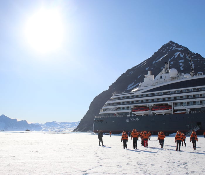 Guests on Ponant's Le Commandant Charcot on the Blosseville coast, Greenland
