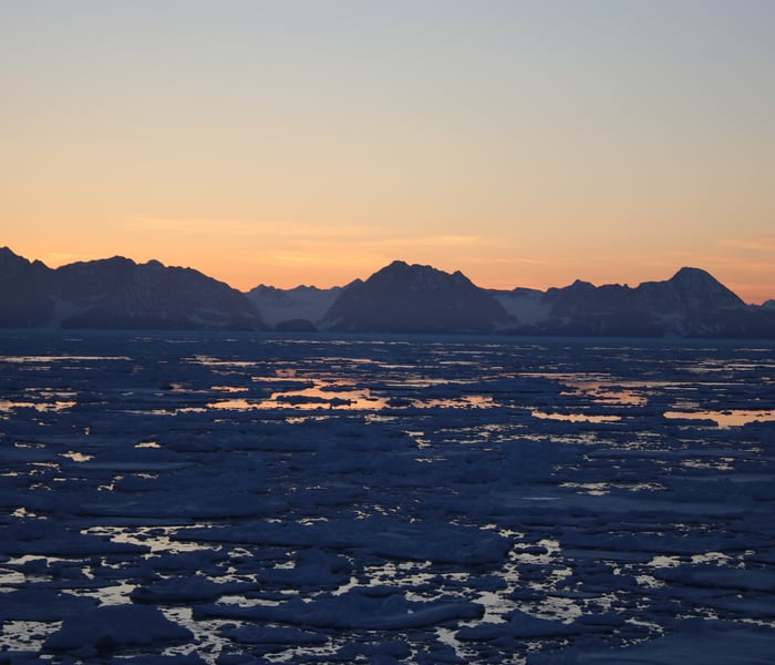Sunset on the Blosseville Coast in Greenland sailing on Le Commandant Charcot