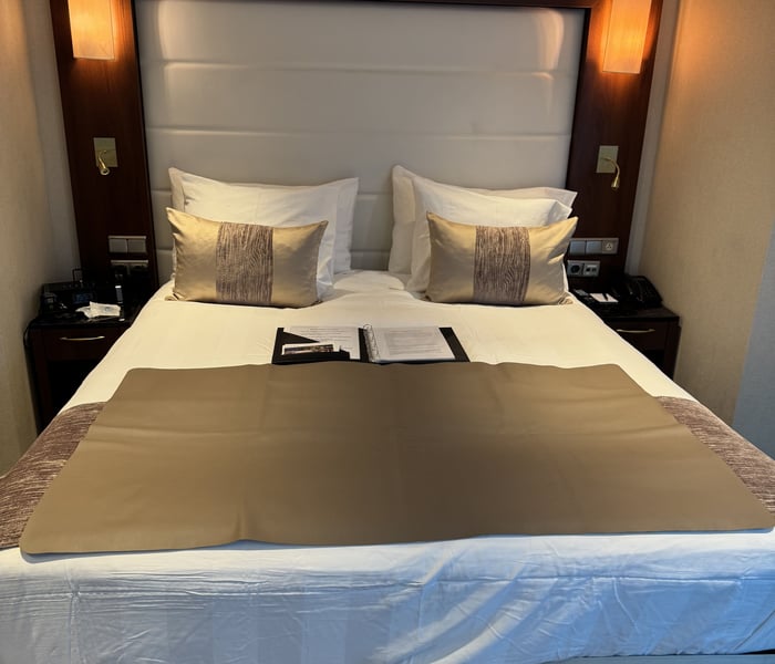 Bed in French Balcony Suite on Tauck River Cruises' MS Inspire