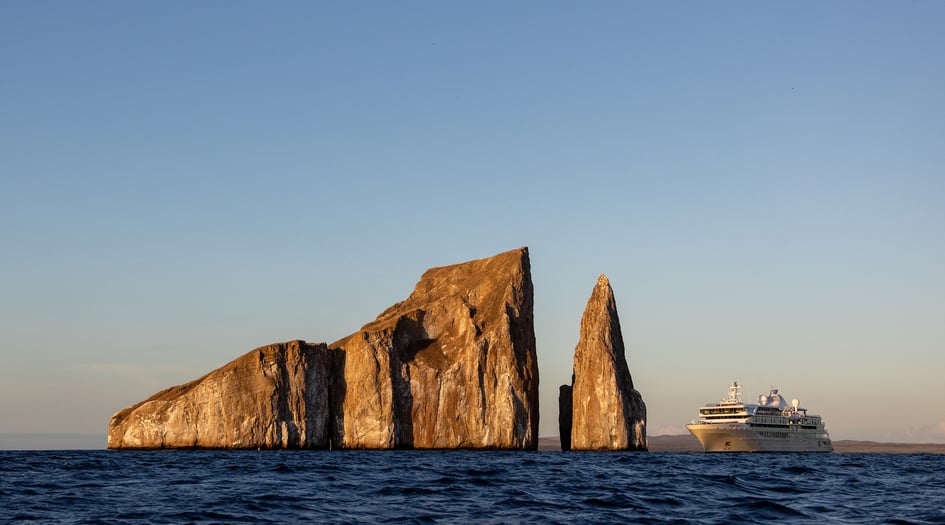 Silver Origin cruising past Kicker Rock in the Galapagos